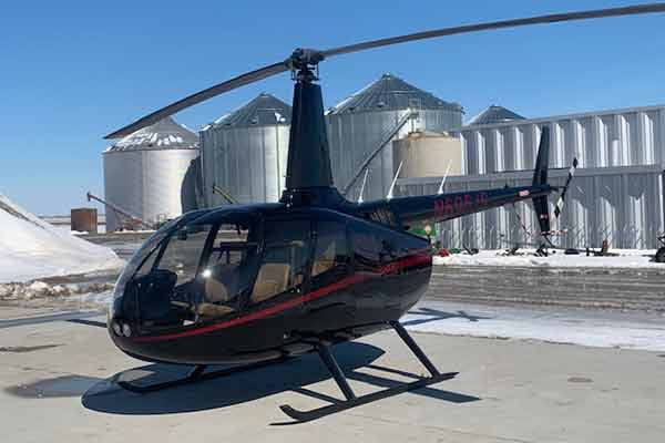 Nebraska-Iowa Helicopter fertilizing a field